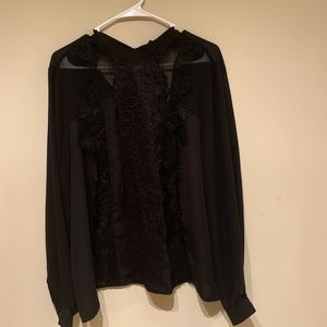 A sheer long sleeve shirt